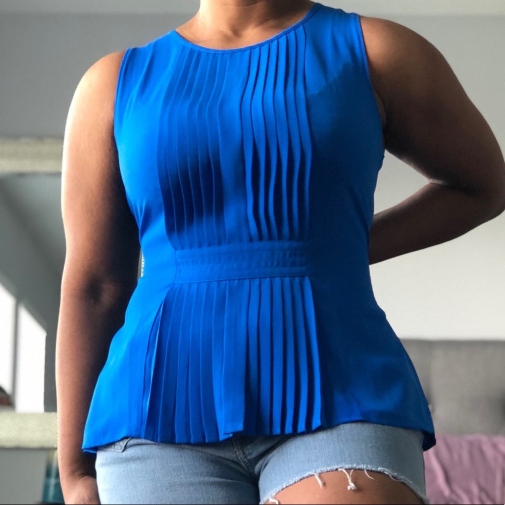 Rich blue peplum top.
